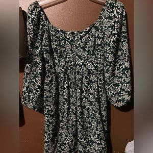 Green dress with flowers on it and it’s a size S